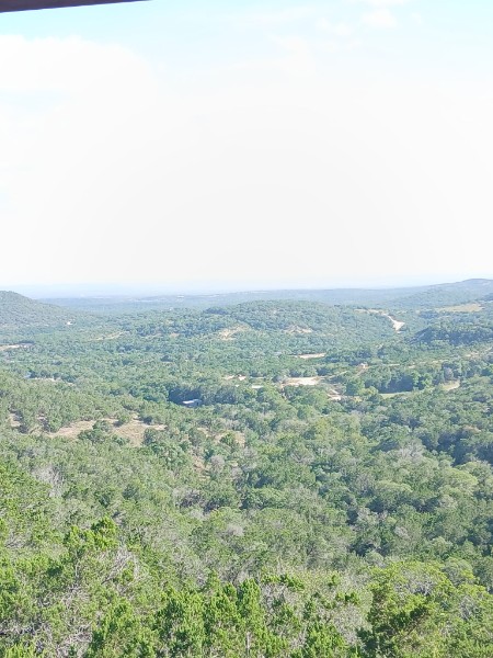 Hazy Texas afternoon light over the valley below Twenty Mile View Cottage