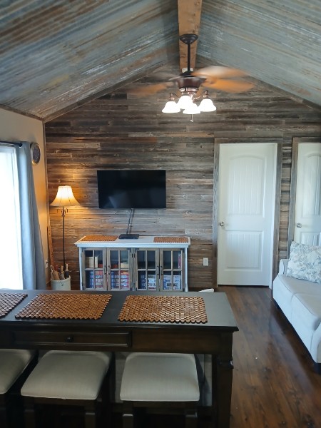 Seating and lamp detail in the furnished living area of Twenty Mile View Cottage